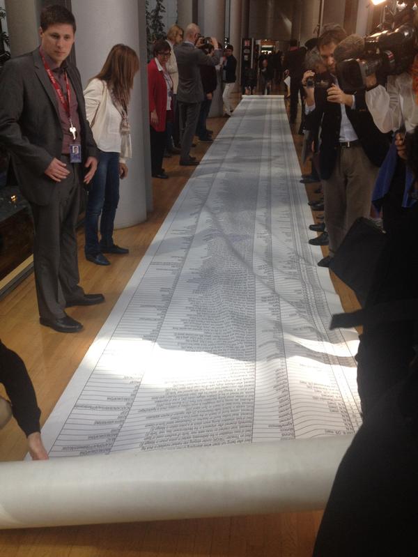 RT List of all migrants who died in the Mediterranean laid down on the floor of the European Parliament.  - embedded image 